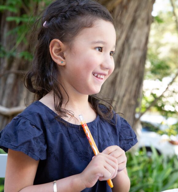 A young child smiling.