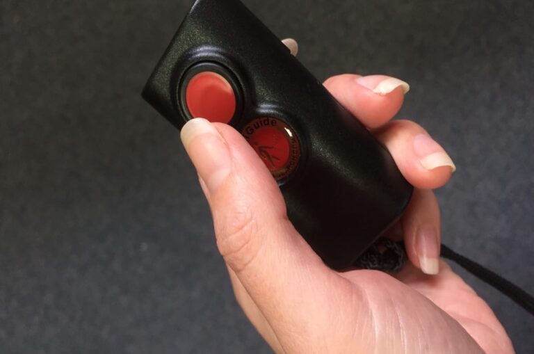 Miniguide device held in hand.